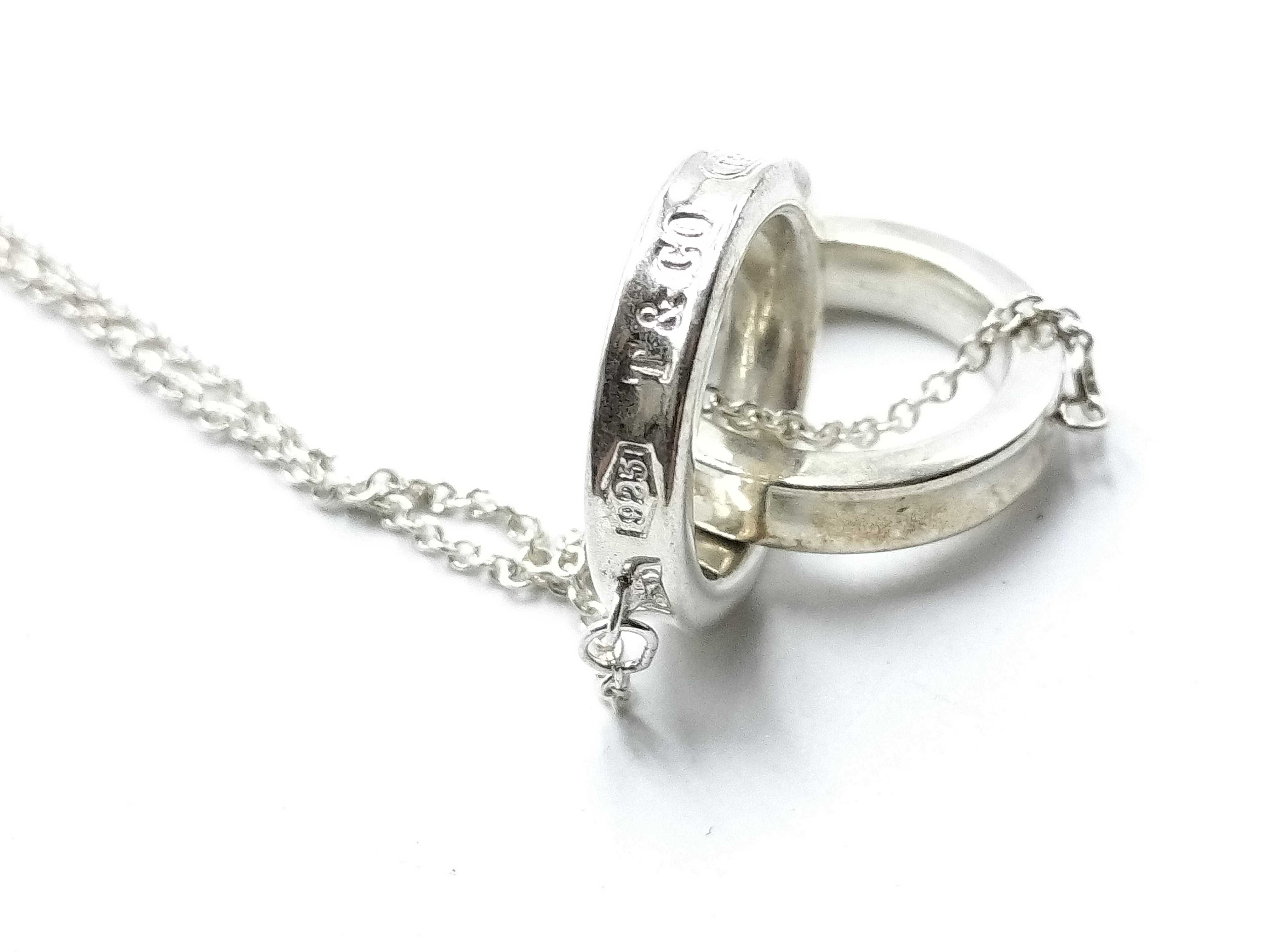 【水曜終了】(10221_0427)Tiffany&Co. インターロッキング ネックレス リング