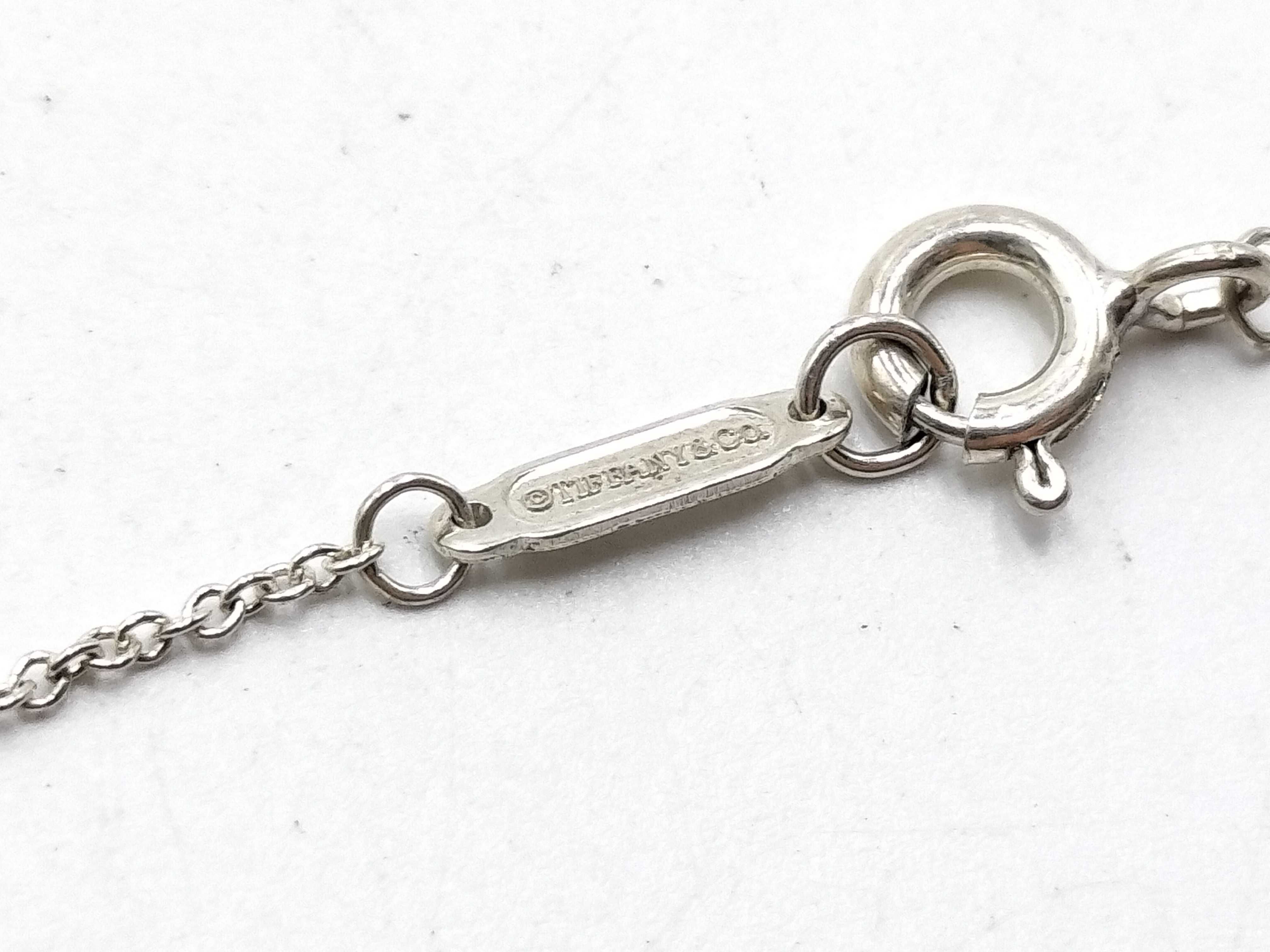 【水曜終了】(10221_0427)Tiffany&Co. インターロッキング ネックレス リング
